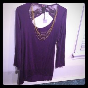 Large shirt. Necklaces attached